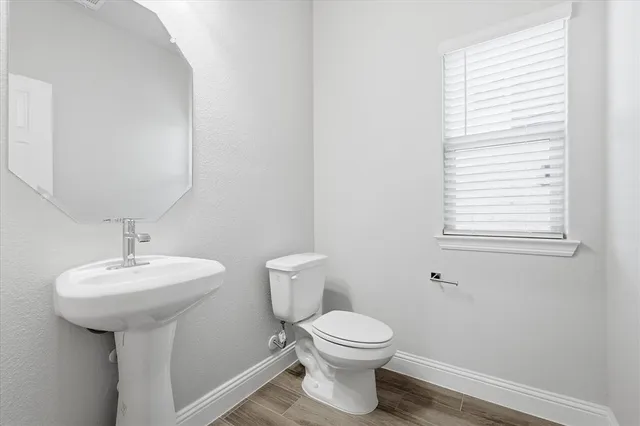 a large kitchen with stainless steel appliances lots of counter space sink and a refrigerator