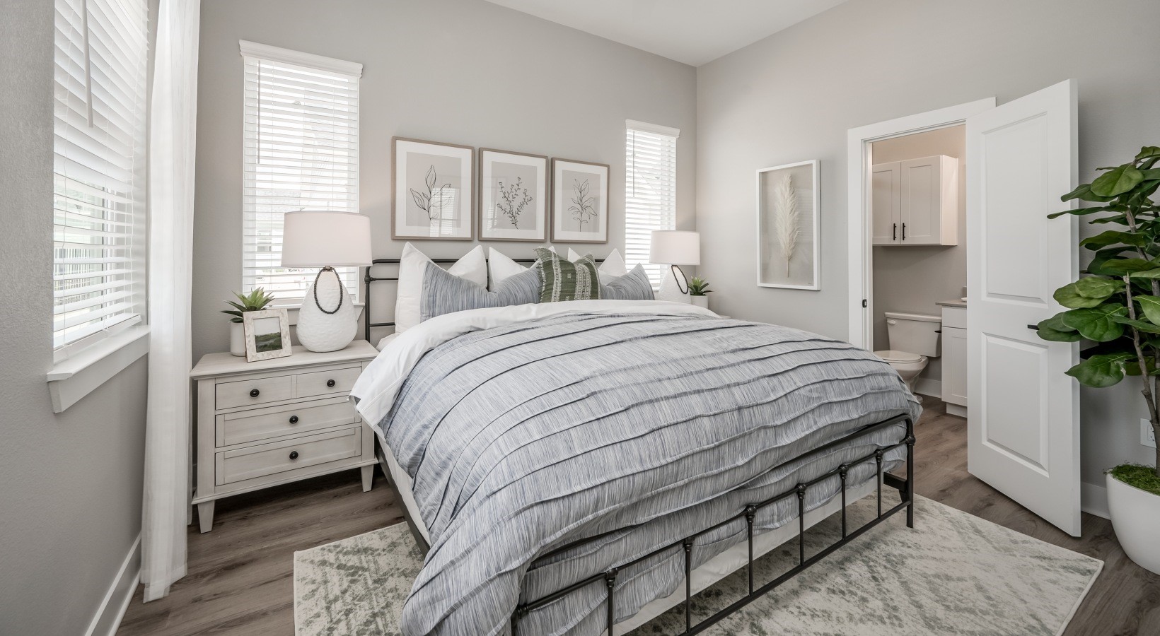 10503 Peek Road, Unit 1206 Cypress, TX 77433 - Photo 3 of 10 a bedroom with a large bed and a large window