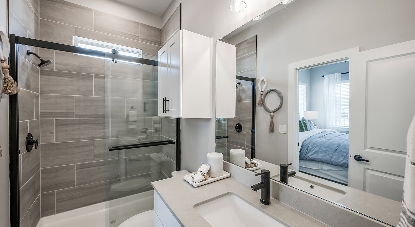 10503 Peek Road, Unit 1206 Cypress, TX 77433 - Photo 6 of 10 a bathroom with a sink toilet and shower