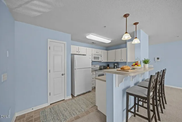 a spacious bedroom with a bed and a table