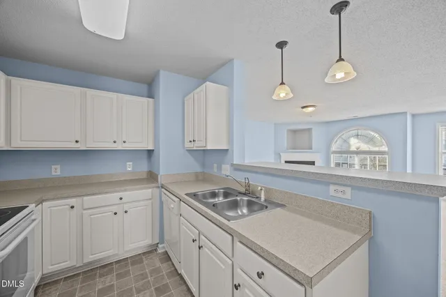 a bathroom with a toilet sink a mirror and vanity