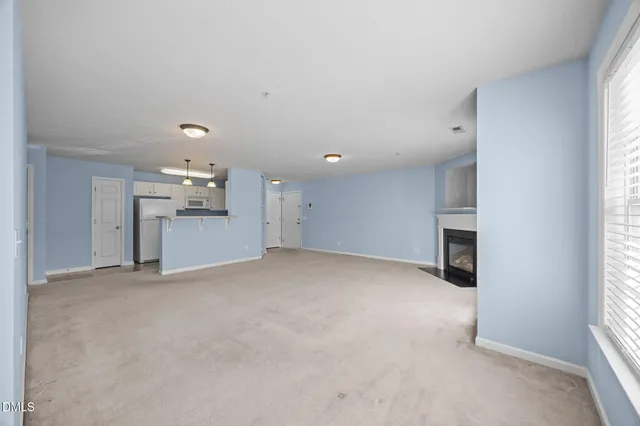 a view of a car park in front of house