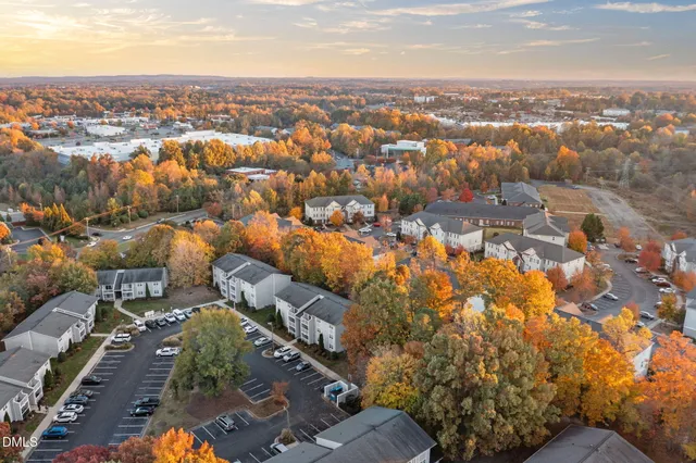 an empty room with furniture and a fireplace