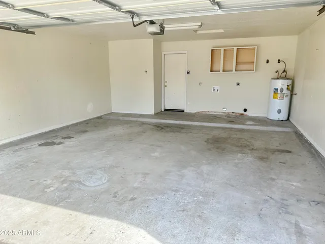 a white toilet sitting next to a bath tub