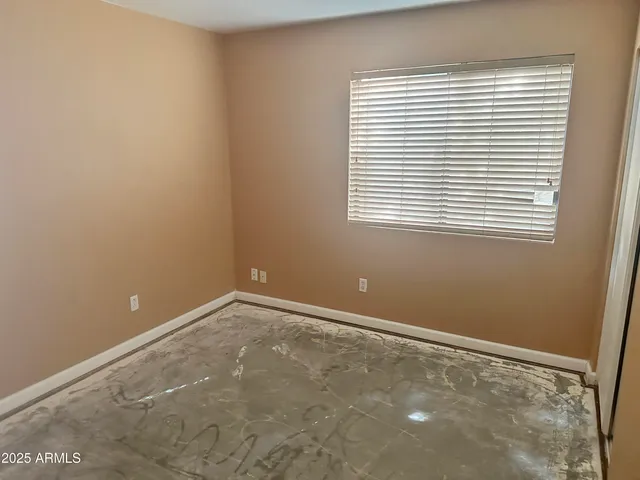 a view of backyard with roof and porch