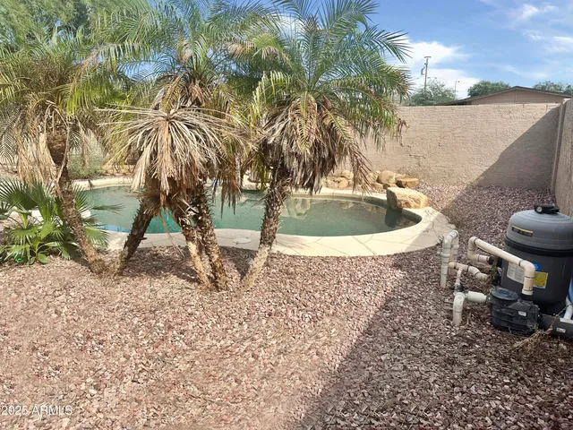 a view of a backyard of the house