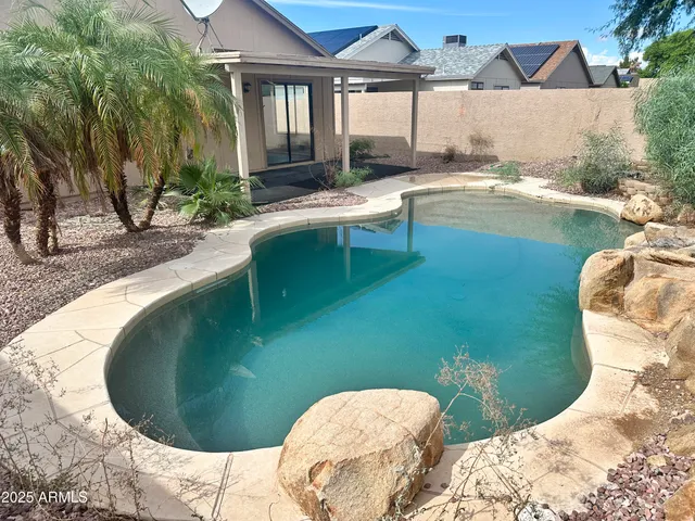 a view of a pathway both side of house