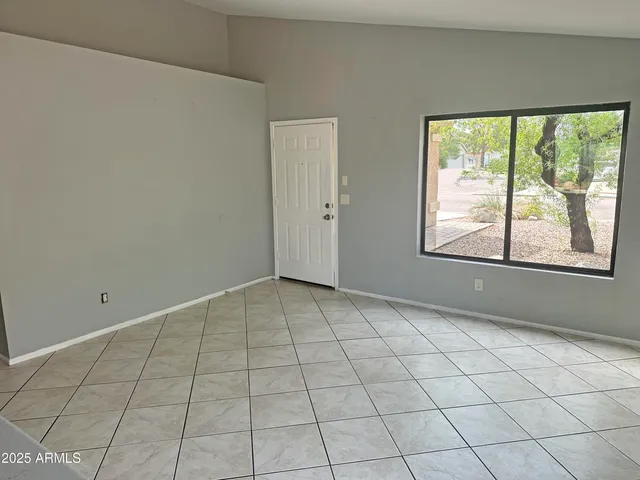 a view of an empty room and window