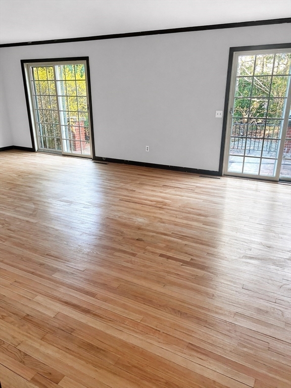 12 Woodland Road Westfield, MA 01085 - Photo 16 of 29 a view of an empty room with wooden floor and a window