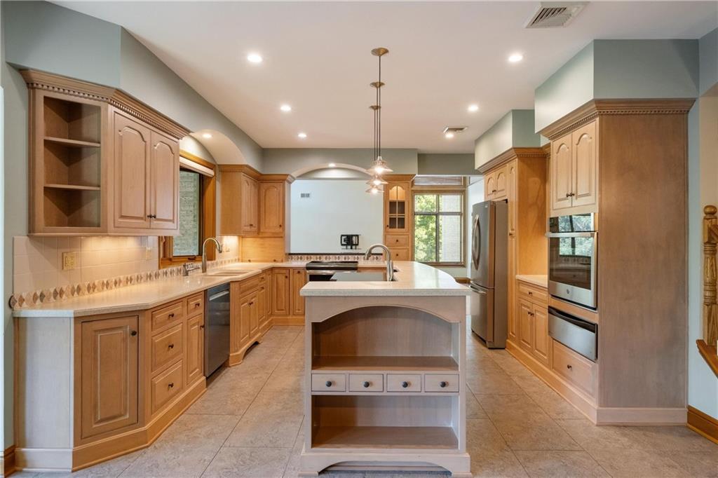 179 Goldsmith Road Pittsburgh, PA 15237 - Photo 12 of 50 a kitchen with stainless steel appliances granite countertop a sink stove and refrigerator