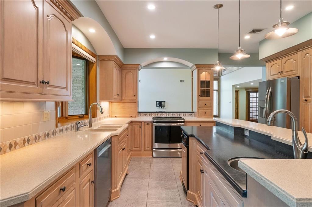 179 Goldsmith Road Pittsburgh, PA 15237 - Photo 13 of 50 a kitchen with a sink stove and cabinets