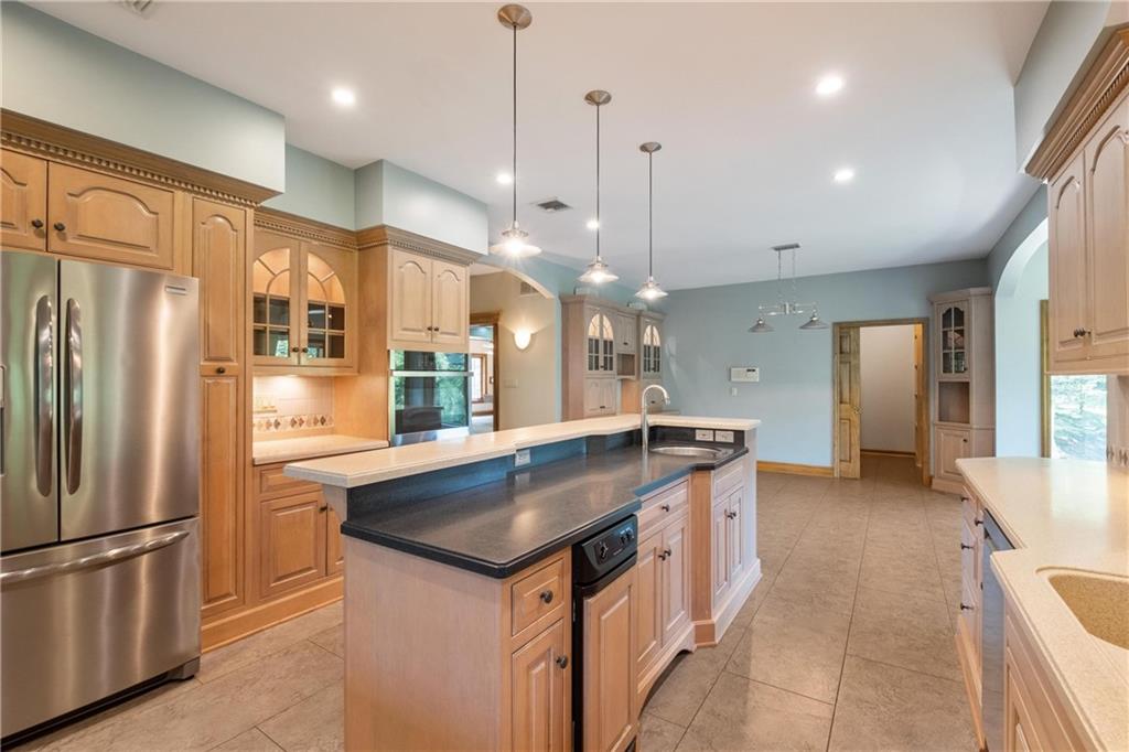 179 Goldsmith Road Pittsburgh, PA 15237 - Photo 14 of 50 a kitchen with stainless steel appliances granite countertop a refrigerator a sink and a stove
