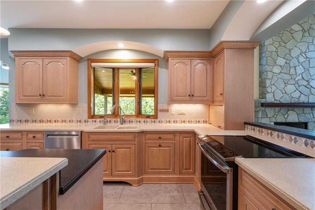 179 Goldsmith Road Pittsburgh, PA 15237 - Photo 15 of 50 a kitchen that has a sink and a stove in it