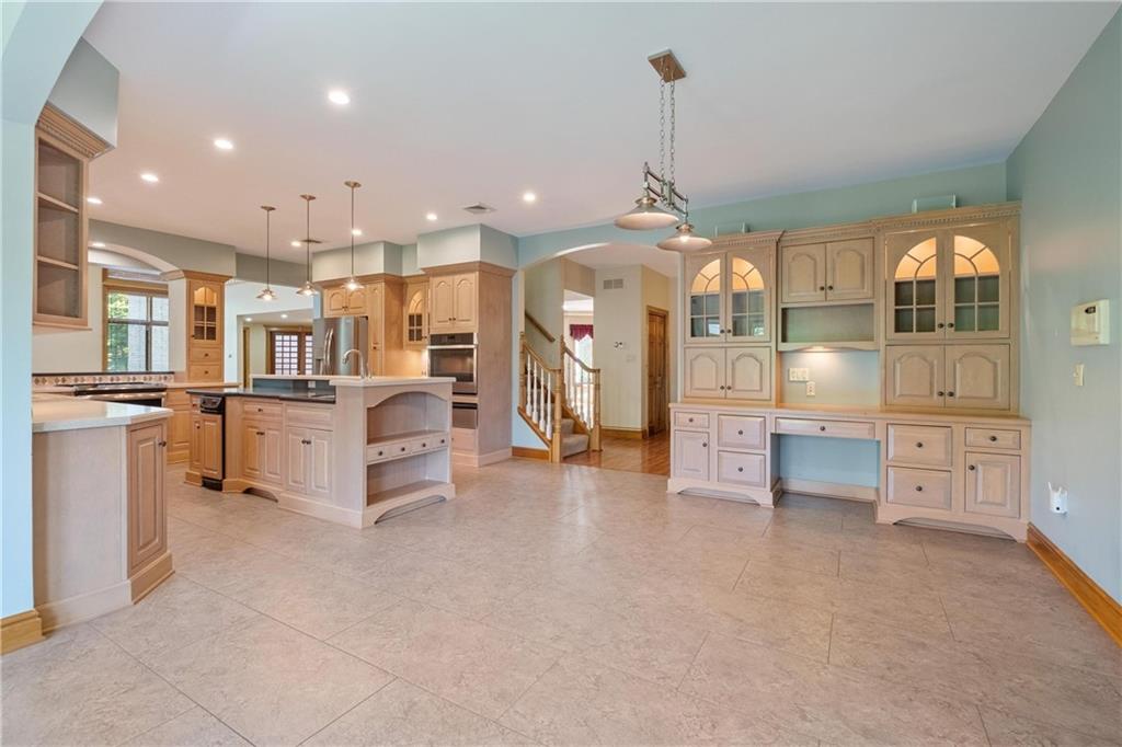 179 Goldsmith Road Pittsburgh, PA 15237 - Photo 18 of 50 a large kitchen with white cabinets and stainless steel appliances