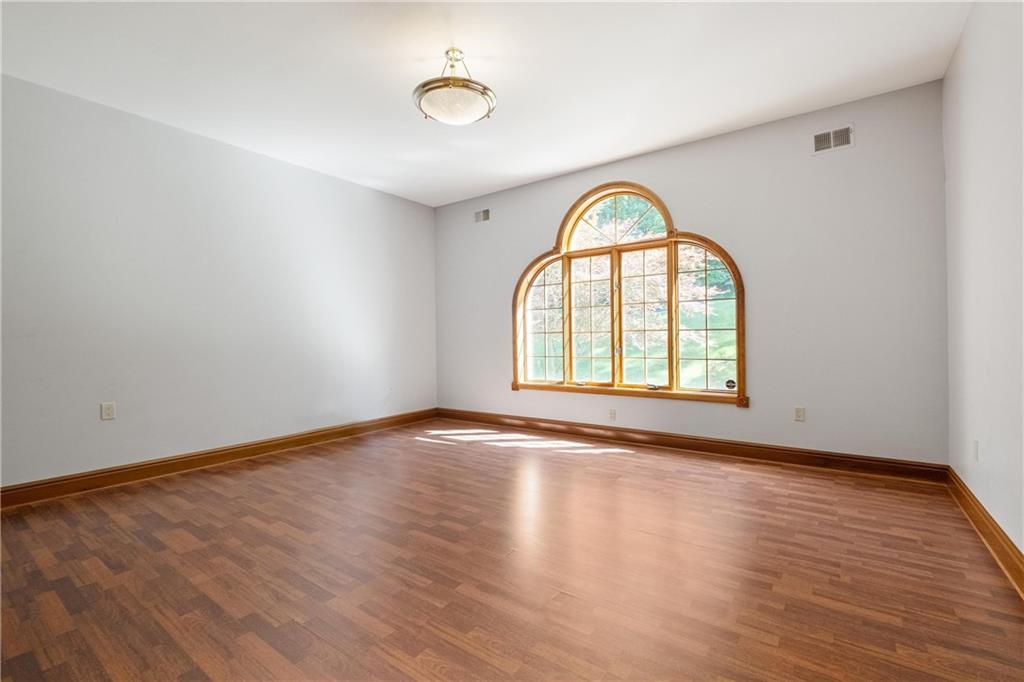 179 Goldsmith Road Pittsburgh, PA 15237 - Photo 19 of 50 an empty room with wooden floor and window