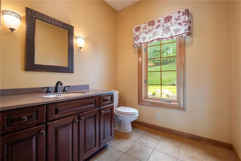 179 Goldsmith Road Pittsburgh, PA 15237 - Photo 20 of 50 a bathroom with a toilet sink and mirror