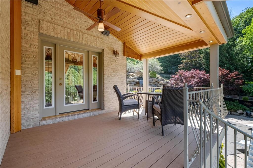 179 Goldsmith Road Pittsburgh, PA 15237 - Photo 27 of 50 a patio with wooden floor a yard a table and chairs