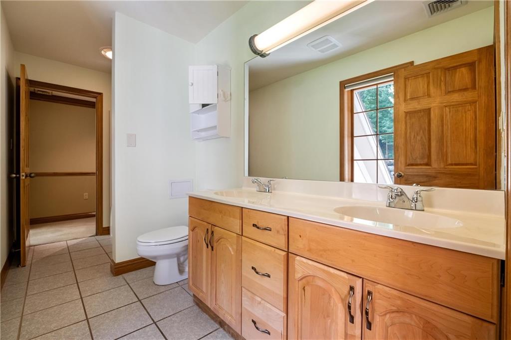 179 Goldsmith Road Pittsburgh, PA 15237 - Photo 34 of 50 a bathroom with a granite countertop sink toilet and shower