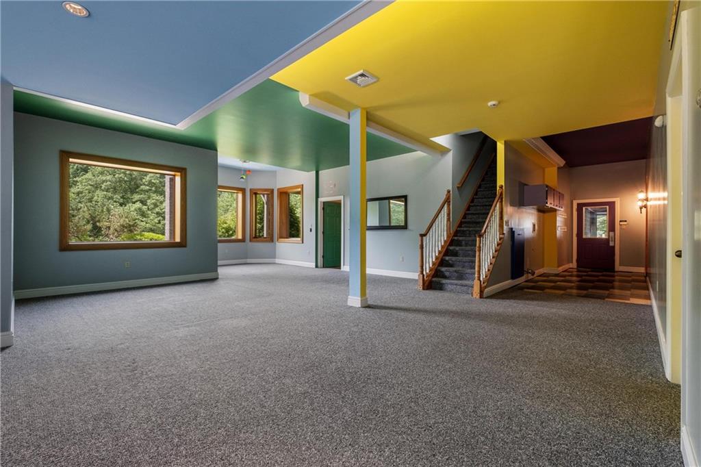 179 Goldsmith Road Pittsburgh, PA 15237 - Photo 43 of 50 a view of an empty room with stairs and a ceiling fan