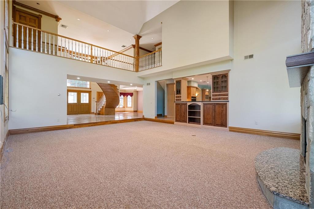 179 Goldsmith Road Pittsburgh, PA 15237 - Photo 10 of 50 a view of a livingroom with an empty space and a window