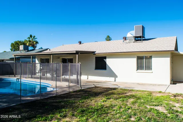a view of a backyard of the house
