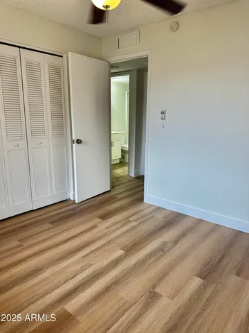 a bathroom with a double vanity sink toilet mirror and shower