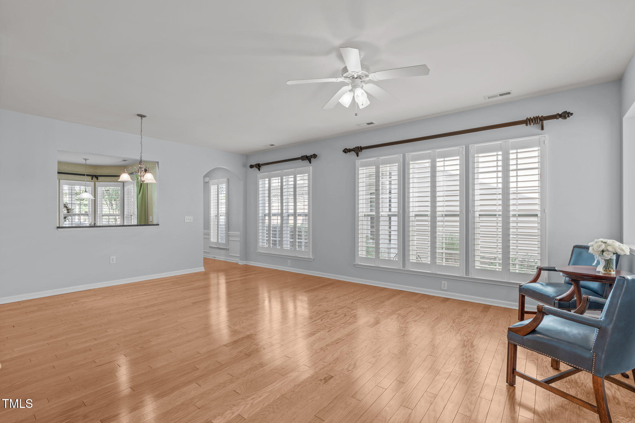 128 Arvind Oaks Circle Cary, NC 27519 - Photo 14 of 34 a view of an empty room with a window and wooden floor