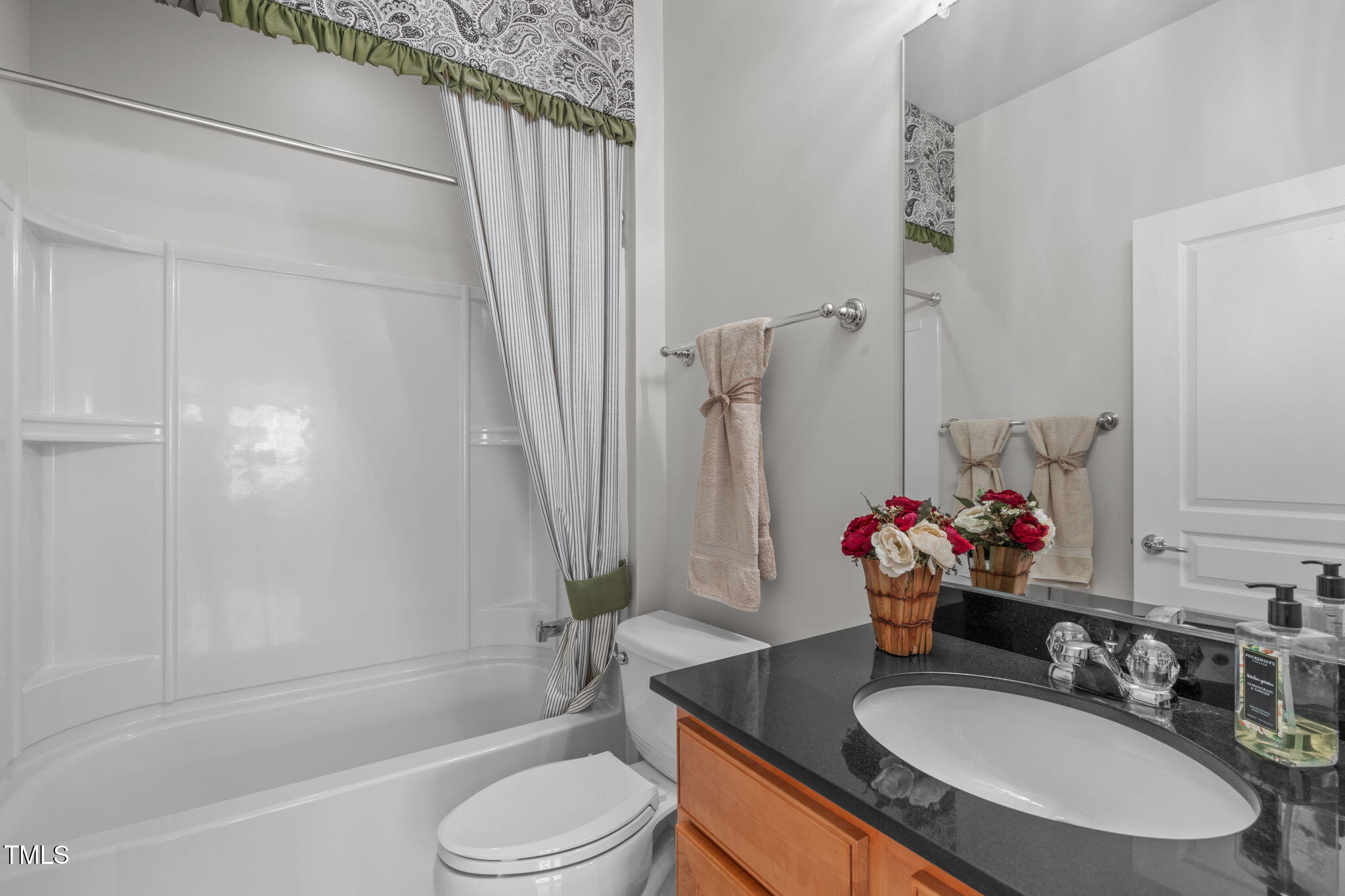 128 Arvind Oaks Circle Cary, NC 27519 - Photo 19 of 34 a bathroom with a sink a toilet and shower