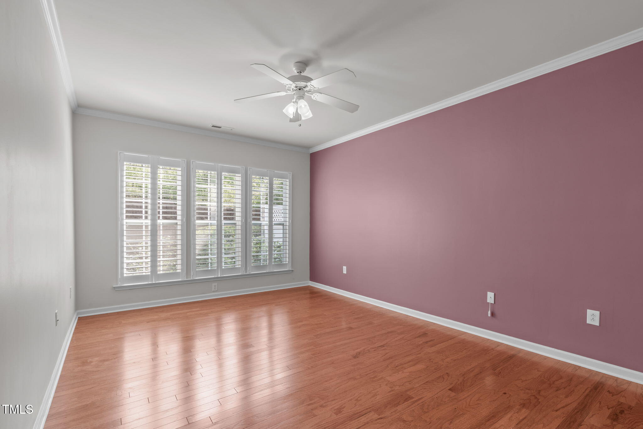 128 Arvind Oaks Circle Cary, NC 27519 - Photo 21 of 34 a view of an empty room with chandelier fan and fire place