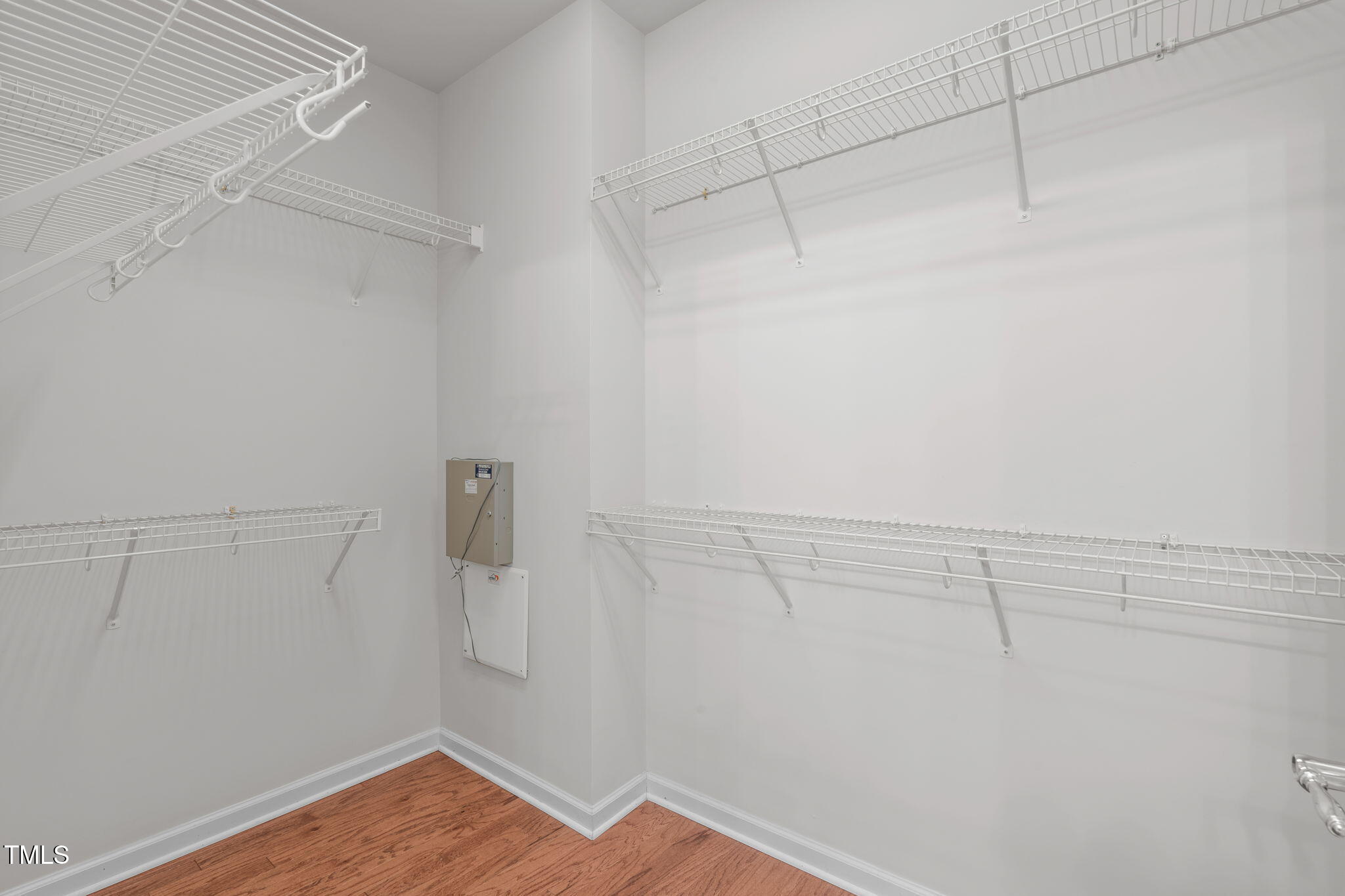 128 Arvind Oaks Circle Cary, NC 27519 - Photo 24 of 34 a view of a room with racks on the wall