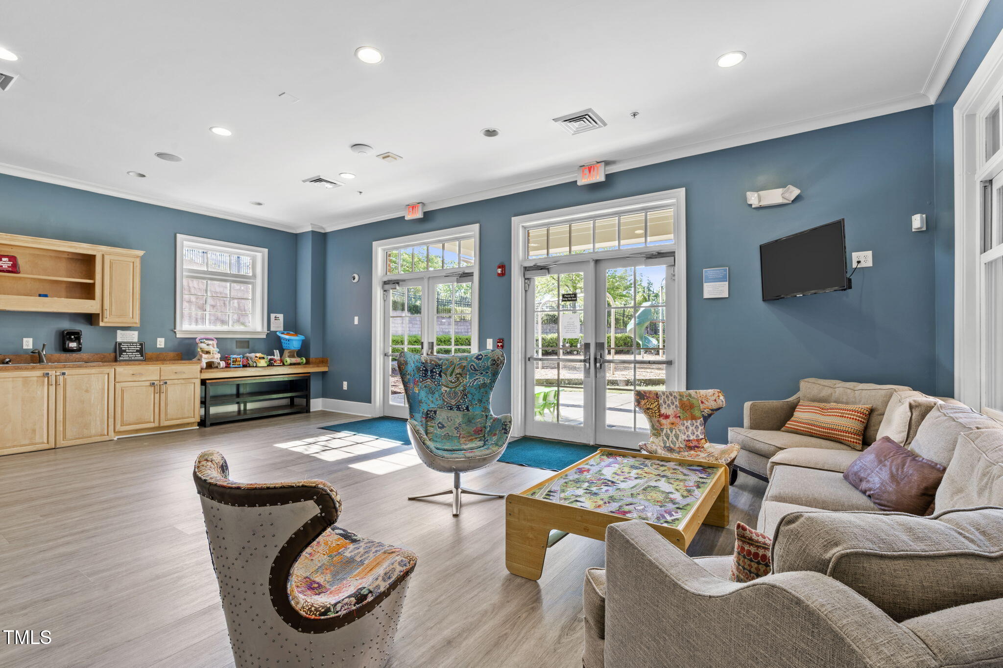 128 Arvind Oaks Circle Cary, NC 27519 - Photo 30 of 34 a living room with furniture and a flat screen tv