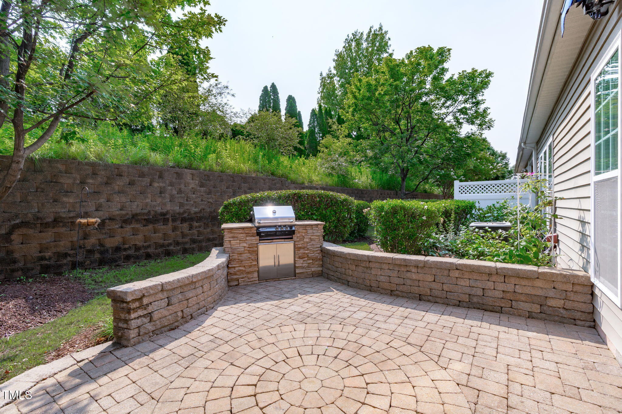 128 Arvind Oaks Circle Cary, NC 27519 - Photo 5 of 34 a backyard of a house with outdoor seating