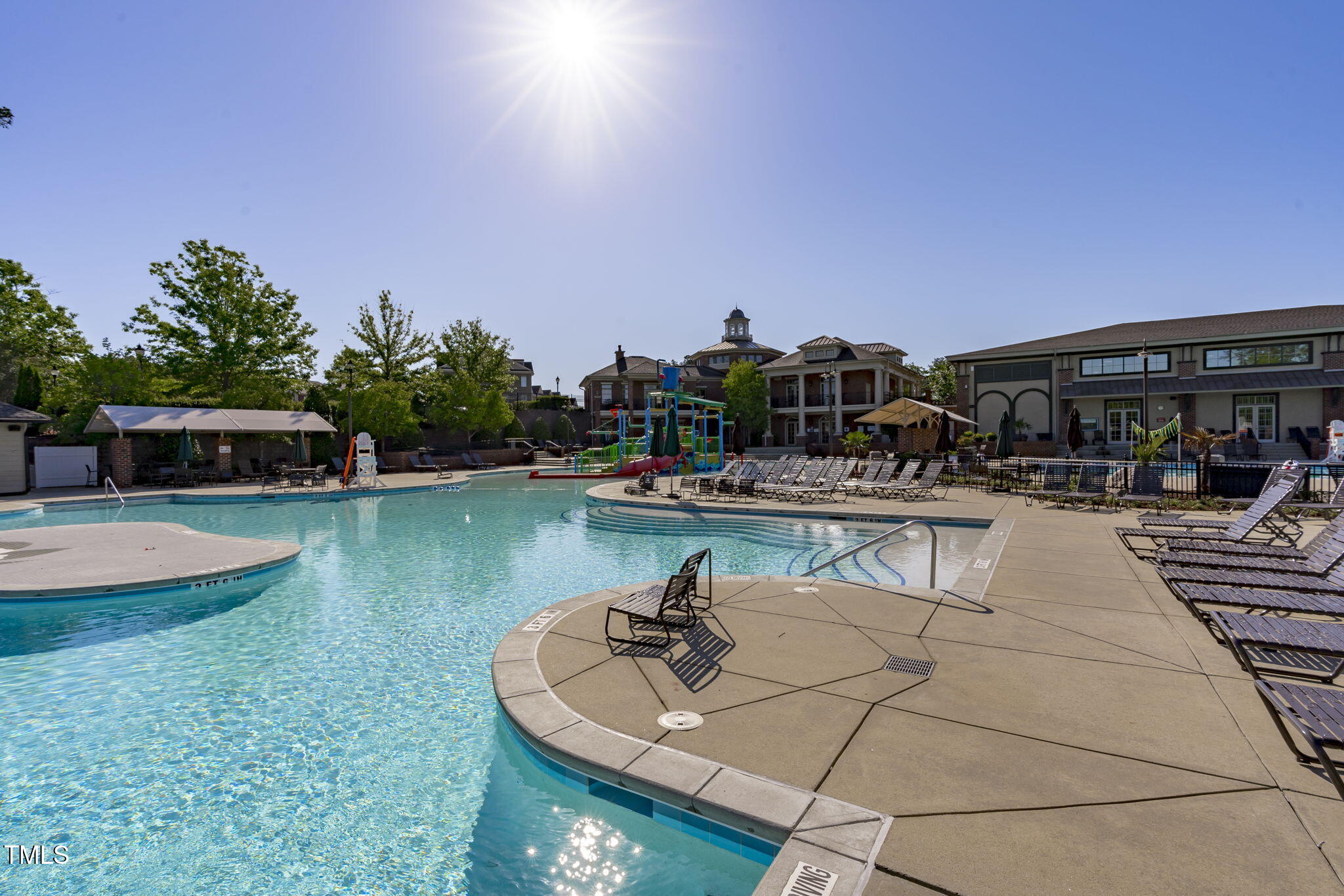 128 Arvind Oaks Circle Cary, NC 27519 - Photo 6 of 34 a view of swimming pool with outdoor seating and trees in the background
