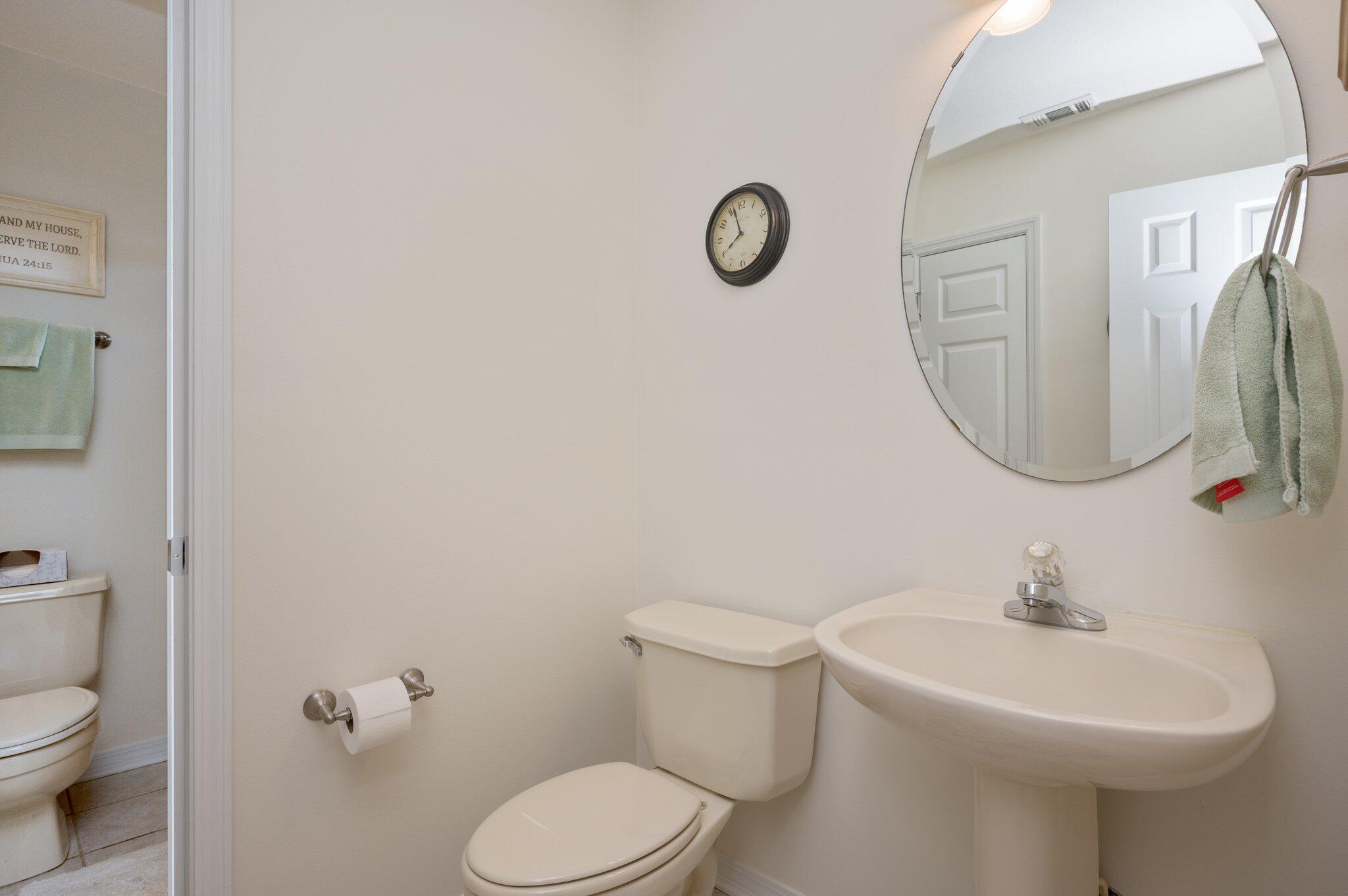 191 Adams Drive Crestview, FL 32536 - Photo 12 of 29 a bathroom with a toilet sink and mirror