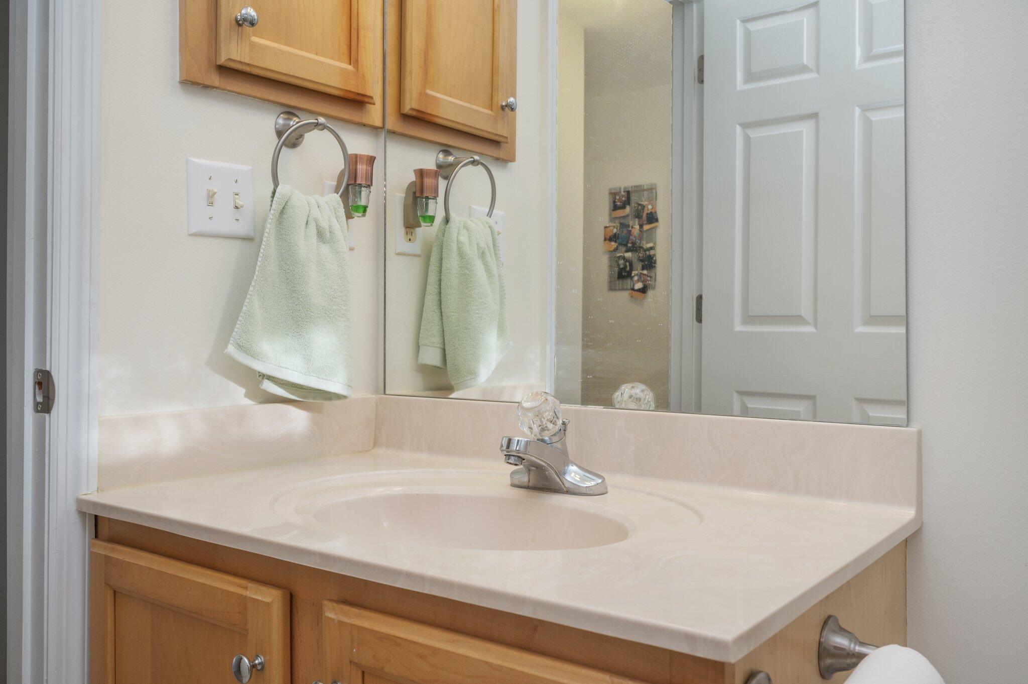 191 Adams Drive Crestview, FL 32536 - Photo 13 of 29 a bathroom with a sink and a mirror
