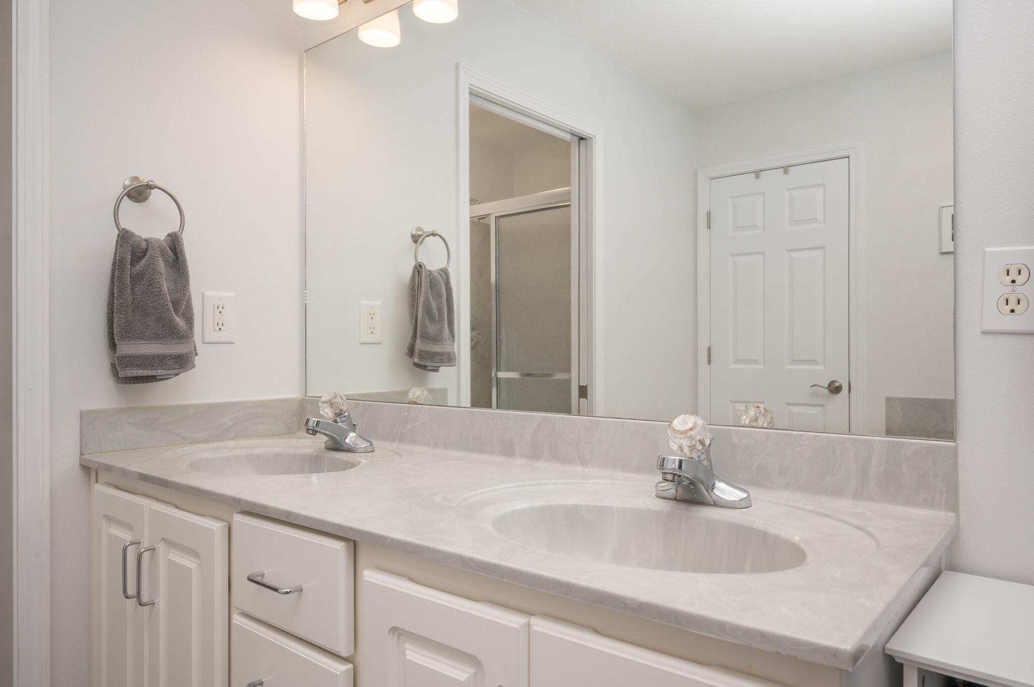 191 Adams Drive Crestview, FL 32536 - Photo 20 of 29 a bathroom with double vanity sinks and a mirror