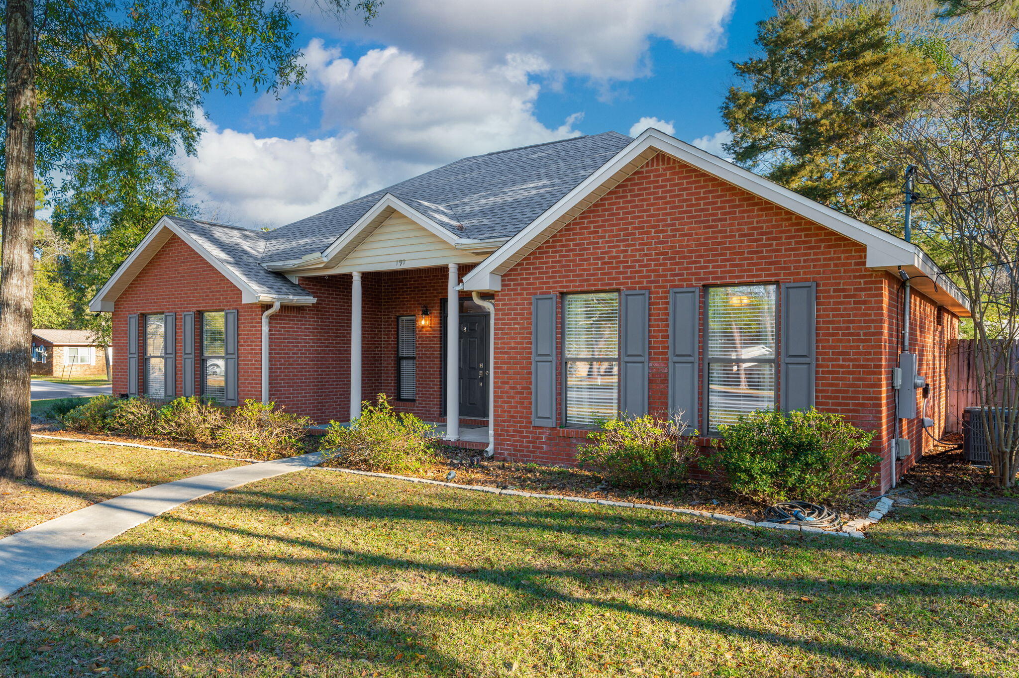 191 Adams Drive Crestview, FL 32536 - Photo 2 of 29 a front view of a house with a yard