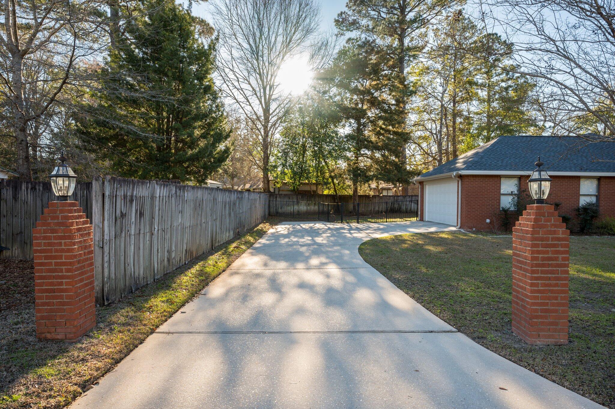 191 Adams Drive Crestview, FL 32536 - Photo 22 of 29 a front view of a house with garden