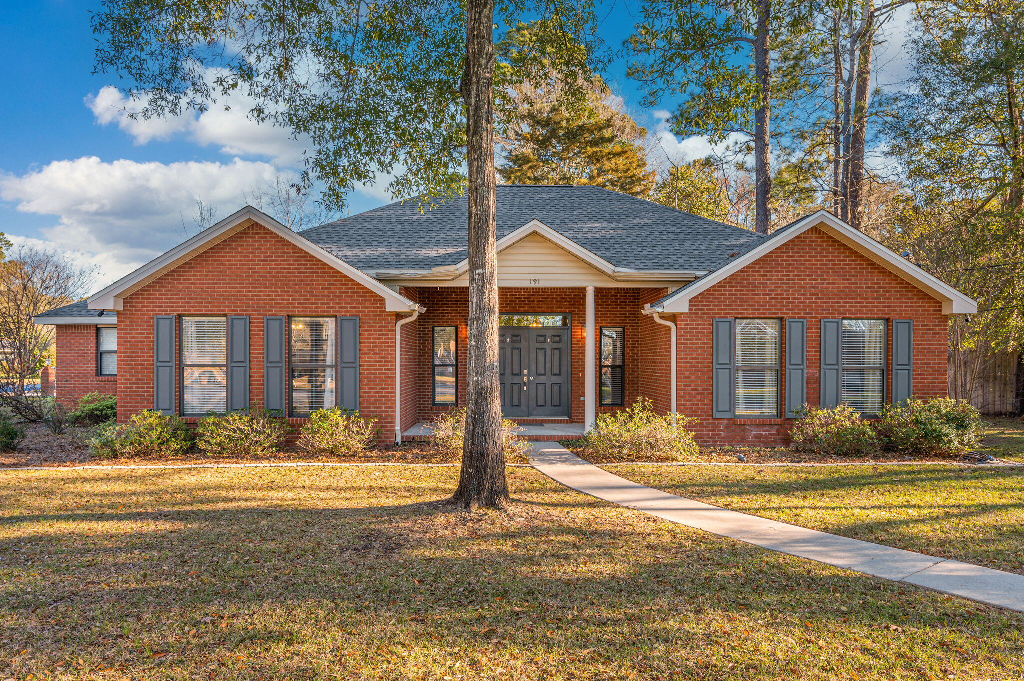 191 Adams Drive Crestview, FL 32536 - Photo 3 of 29 a front view of a house with a yard