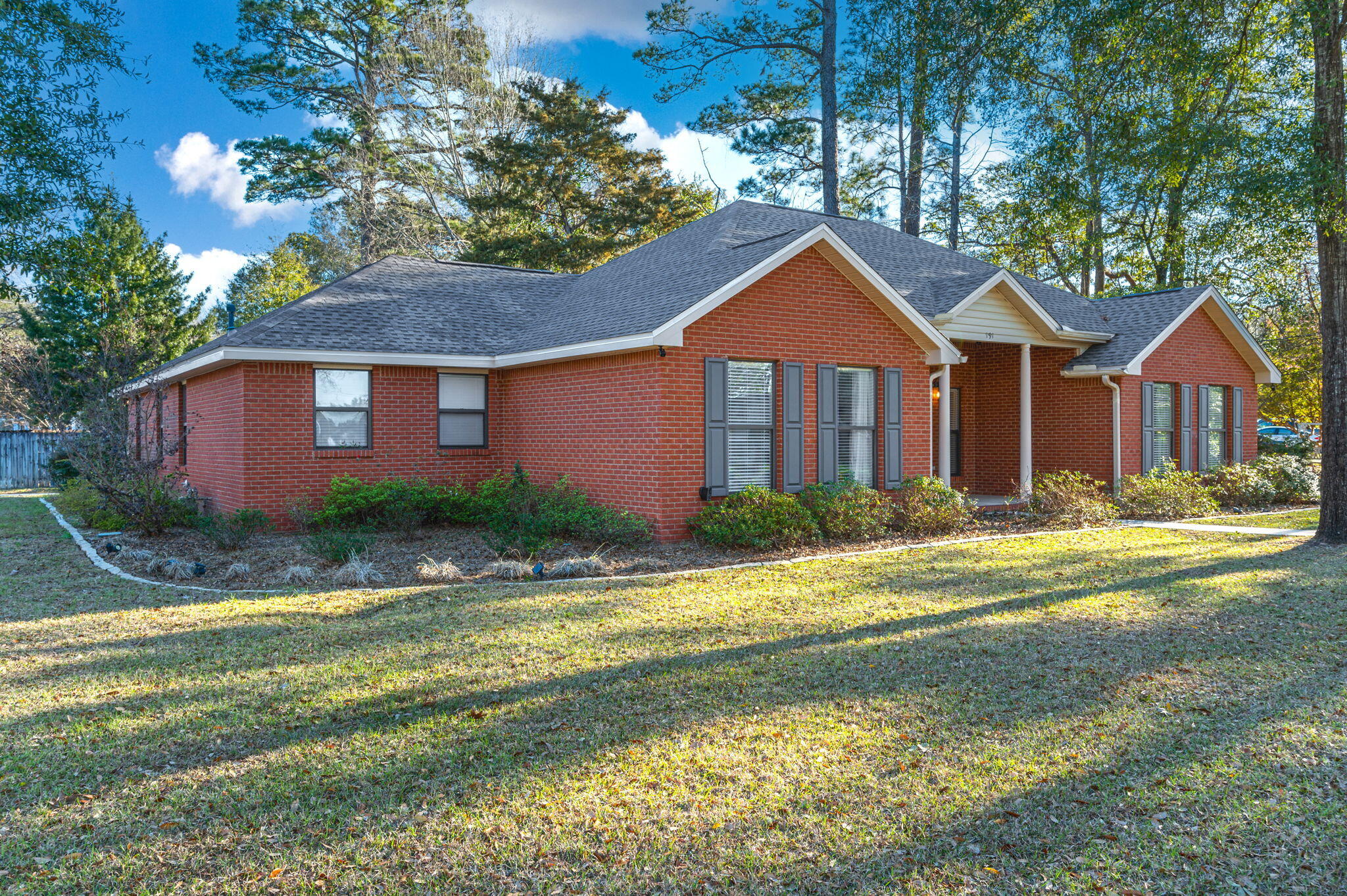 191 Adams Drive Crestview, FL 32536 - Photo 4 of 29 a front view of a house with a yard and garage