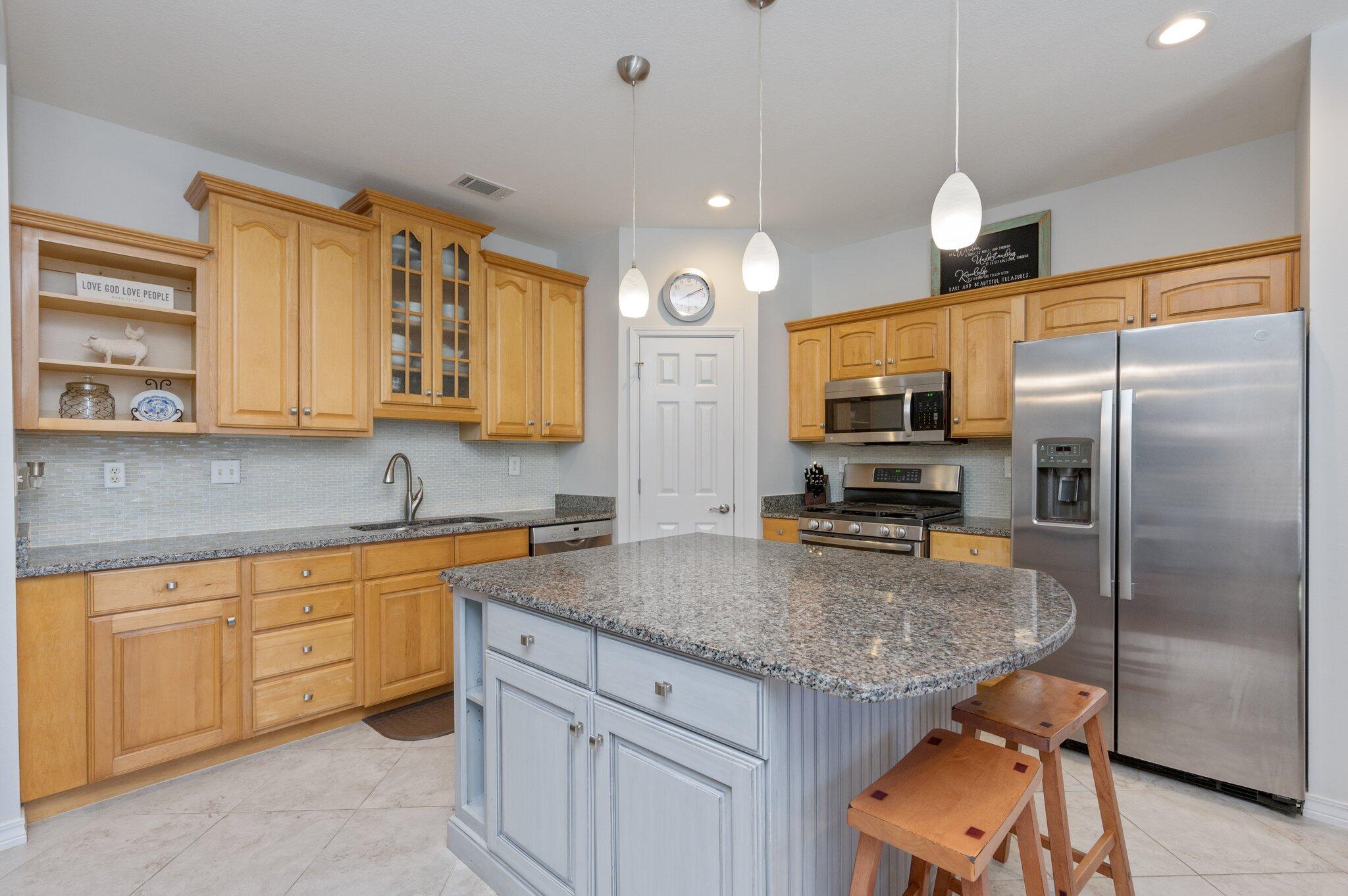 191 Adams Drive Crestview, FL 32536 - Photo 8 of 29 a kitchen with stainless steel appliances granite countertop a sink refrigerator and microwave