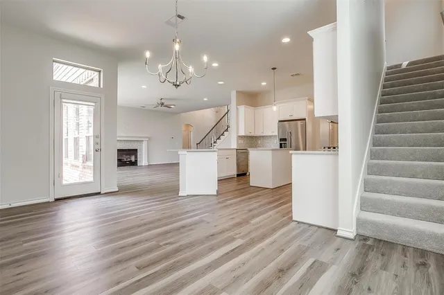 a view of kitchen with furniture and wooden floor