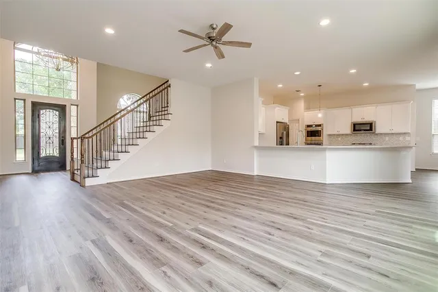 a view of kitchen with cabinets and wooden floor