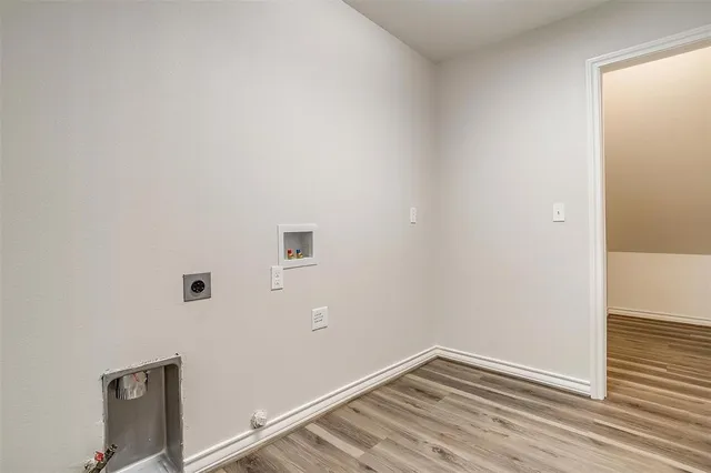 a view of small space with wooden floor