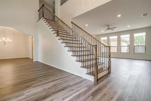 a view of entryway with stairs and wooden floor