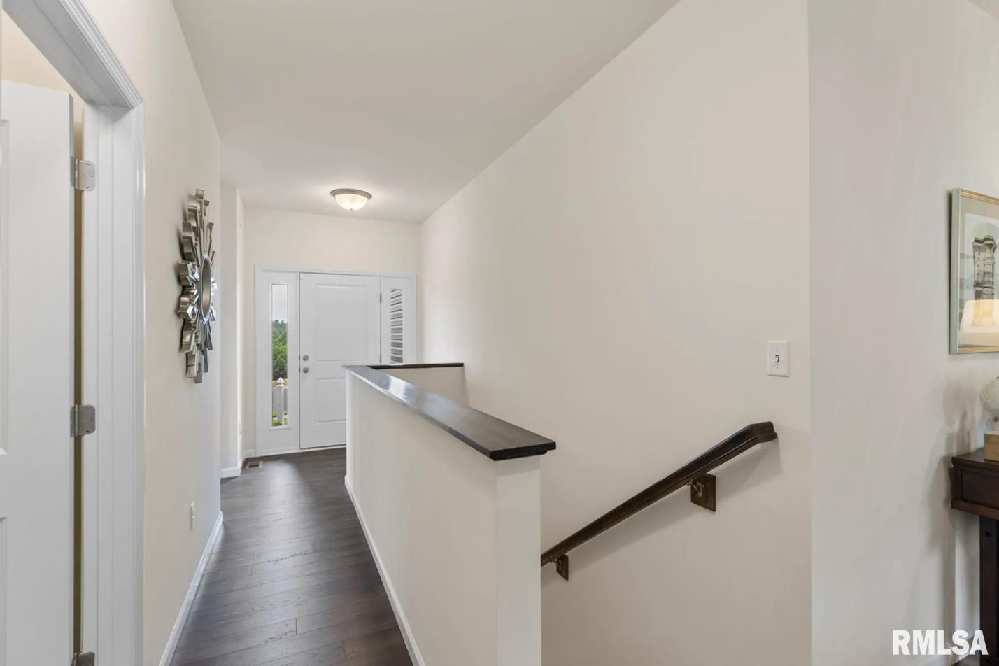 801 Williams Way Carbon Cliff, IL 61239 - Photo 3 of 6 a view of a hallway with wooden floor and staircase