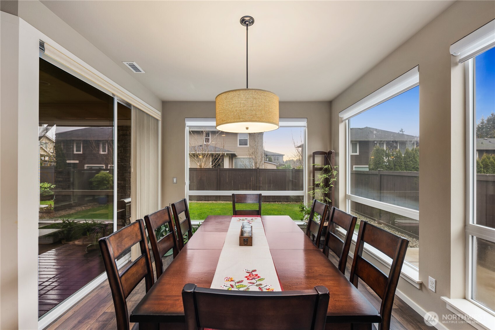 5627 South 336th Place Auburn, WA 98001 - Photo 15 of 40 a view of a dining room with furniture window and wooden floor