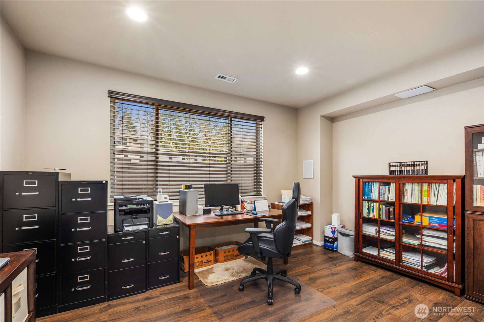5627 South 336th Place Auburn, WA 98001 - Photo 24 of 40 a view of a workspace with furniture and a bookshelf