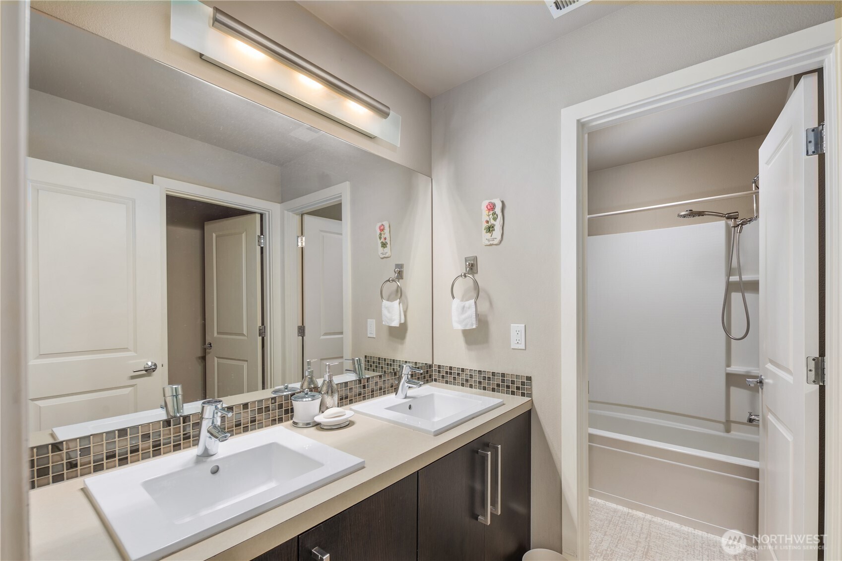 5627 South 336th Place Auburn, WA 98001 - Photo 26 of 40 a bathroom with a sink and a mirror