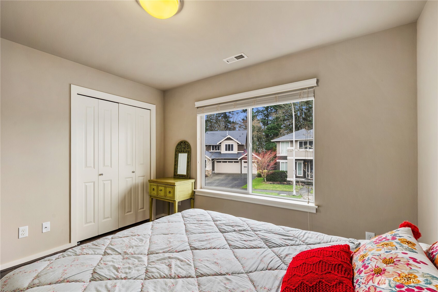 5627 South 336th Place Auburn, WA 98001 - Photo 29 of 40 a bedroom with a bed and a window